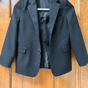 Boys size 7 regular black suit coat. Worn 2-3 times. Non smoking home.